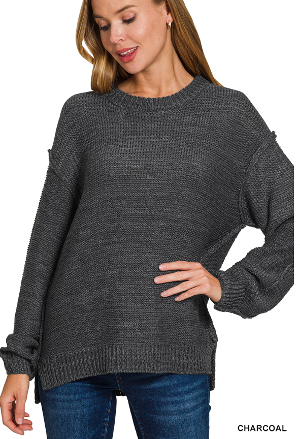 Exposed seam round neck sweater